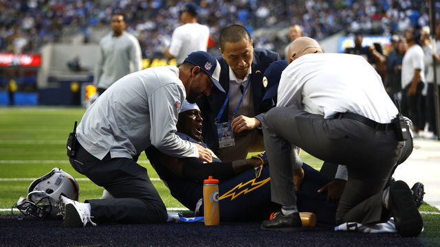 INGLEWOOD, CALIFORNIA - OCTOBER 23: J.C. Jackson #27 of the Los Angeles Chargers lies on the field with an injury during the second quarter of the game against the Seattle Seahawks at SoFi Stadium on October 23, 2022 in Inglewood, California.