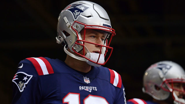 FOXBOROUGH, MASSACHUSETTS - JANUARY 02: Mac Jones #10 of the New England Patriots looks on before the game against the Jacksonville Jaguars at Gillette Stadium on January 02, 2022 in Foxborough, Massachusetts.