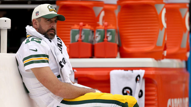 LANDOVER, MARYLAND - OCTOBER 23: Aaron Rodgers #12 of the Green Bay Packers looks on from the bench during the third quarter of the game against the Washington Commanders at FedExField on October 23, 2022 in Landover, Maryland.
