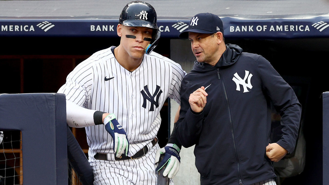 NEW YORK, NEW YORK - OCTOBER 01: Aaron Judge #99 and manager Aaron Boone #17 of the New York Yankees talk before his at bat in the eighth inning against the Baltimore Orioles at Yankee Stadium on October 01, 2022 in the Bronx borough of New York City.