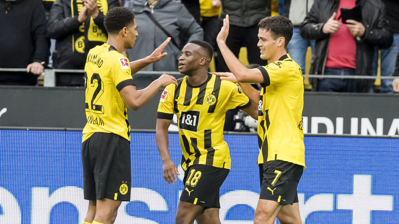 DORTMUND, GERMANY - OCTOBER 22: Giovanni Reyna of Borussia Dortmund cheers after scoring his teams 3rd goal with Youssoufa Moukoko and Jude Bellingham of Borussia Dortmund during the Bundesliga match between Borussia Dortmund and VfB Stuttgart at Signal Iduna Park on October 22, 2022 in Dortmund, Germany.