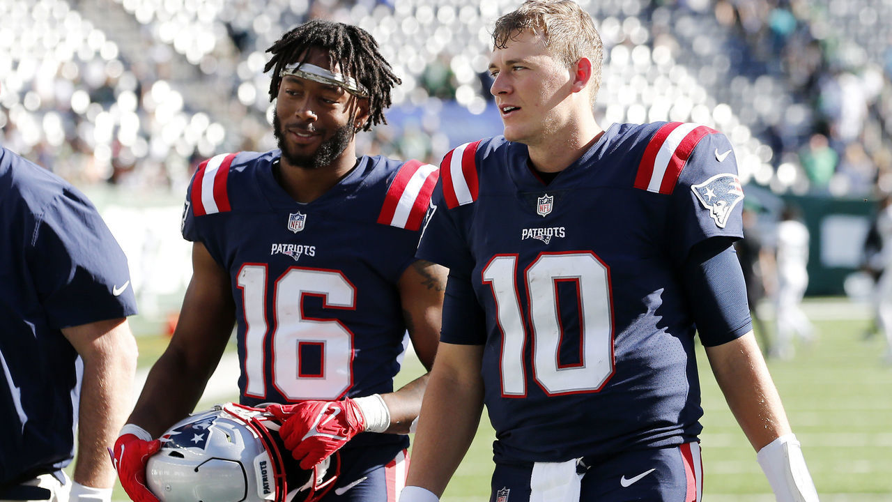 EAST RUTHERFORD, NEW JERSEY - SEPTEMBER 19: (NEW YORK DAILIES OUT) Mac Jones #10 and Jakobi Meyers #16 of the New England Patriots walk off the field after defeating the New York Jets at MetLife Stadium on September 19, 2021 in East Rutherford, New Jersey. The Patriots defeated the Jets 25-6.