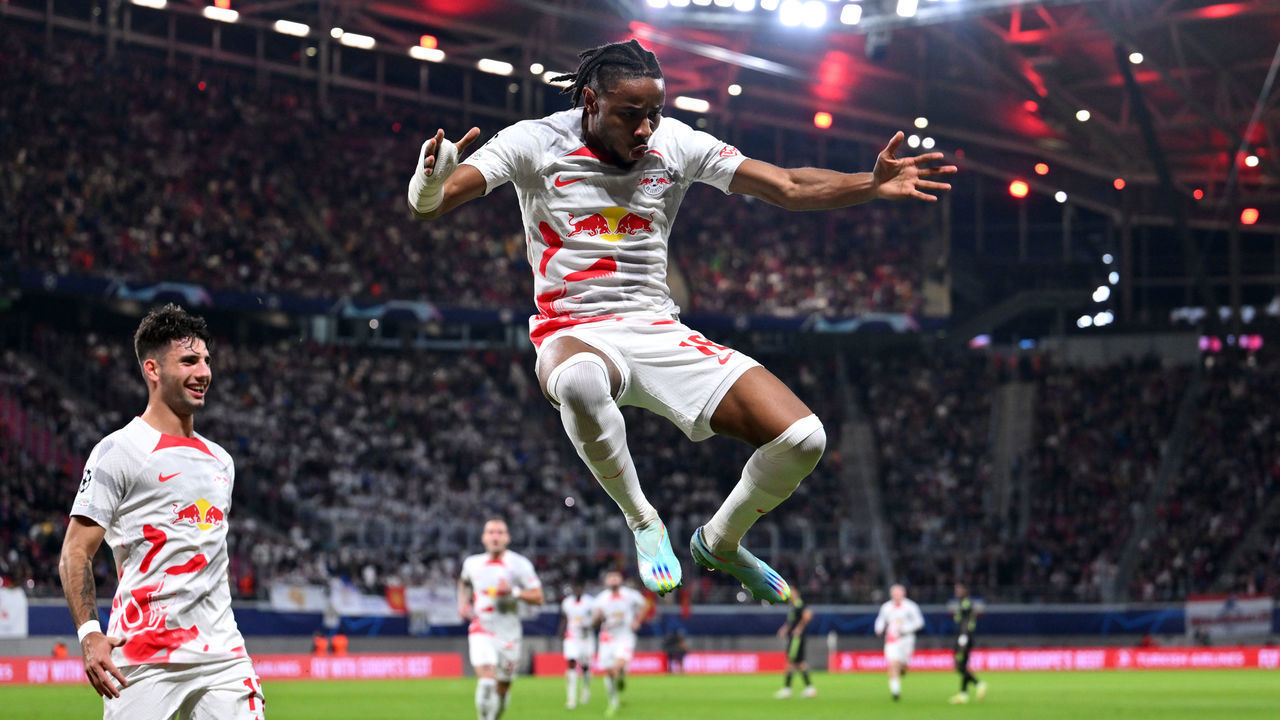 LEIPZIG, GERMANY - OCTOBER 25: Christopher Nkunku of RB Leipzig celebrates scoring their side's second goal with teammates during the UEFA Champions League group F match between RB Leipzig and Real Madrid at Red Bull Arena on October 25, 2022 in Leipzig, Germany.