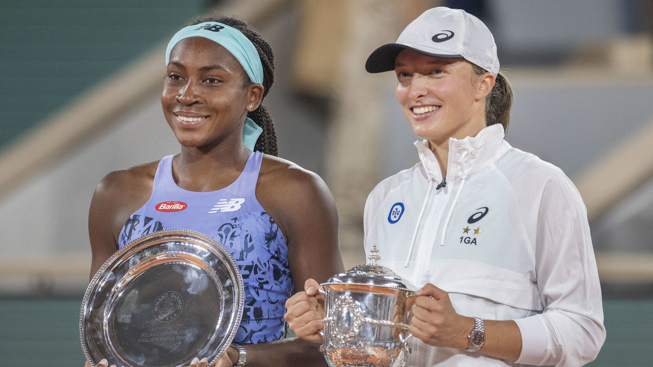PARIS, FRANCE JUNE 4. Coco Gauff of the United States with the runners up trophy and Iga Swiatek of Poland with the winners trophy at the trophy presentation ceremony after the Singles Final for Women on Court Philippe Chatrier at the 2022 French Open Tennis Tournament at Roland Garros on June 4th 2022 in Paris, France.