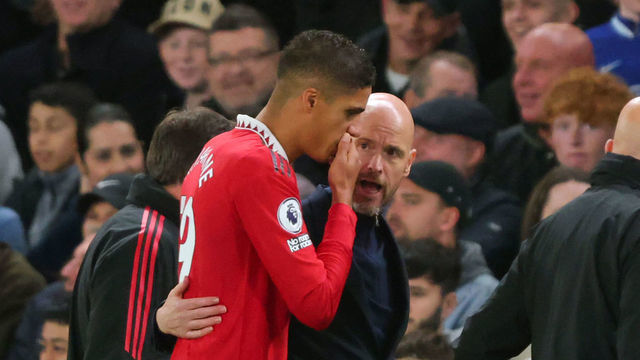 LONDON, ENGLAND - OCTOBER 22: Erik ten Hag Manager/Head Coach of Manchester United speaks with Raphael Varane as he leaves the game injured during the Premier League match between Chelsea FC and Manchester United at Stamford Bridge on October 22, 2022 in London, United Kingdom.