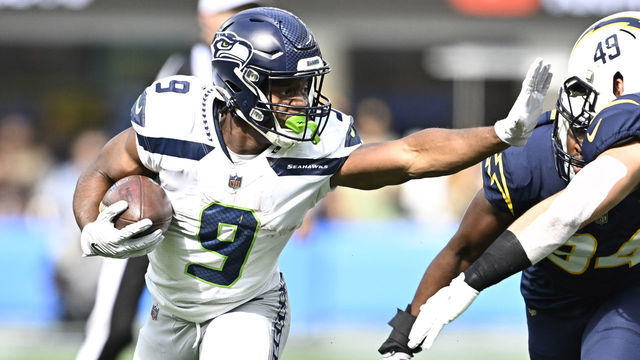 Inglewood, CA - October 23: Running back Kenneth Walker III #9 of the Seattle Seahawks runs for first down against the Los Angeles Chargers in the first half of a NFL football game at SoFi Stadium in Inglewood on Sunday, October 23, 2022. Seattle Seahawks won 37-23.