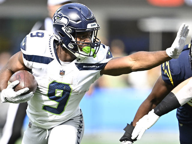 Inglewood, CA - October 23: Running back Kenneth Walker III #9 of the Seattle Seahawks runs for first down against the Los Angeles Chargers in the first half of a NFL football game at SoFi Stadium in Inglewood on Sunday, October 23, 2022. Seattle Seahawks won 37-23.