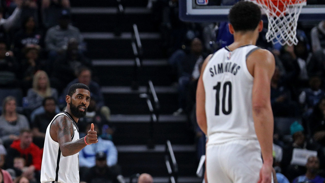 MEMPHIS, TENNESSEE - OCTOBER 24: Kyrie Irving #11 of the Brooklyn Nets gestures twoards Ben Simmons #10 during the game against the Memphis Grizzlies at FedExForum on October 24, 2022 in Memphis, Tennessee.