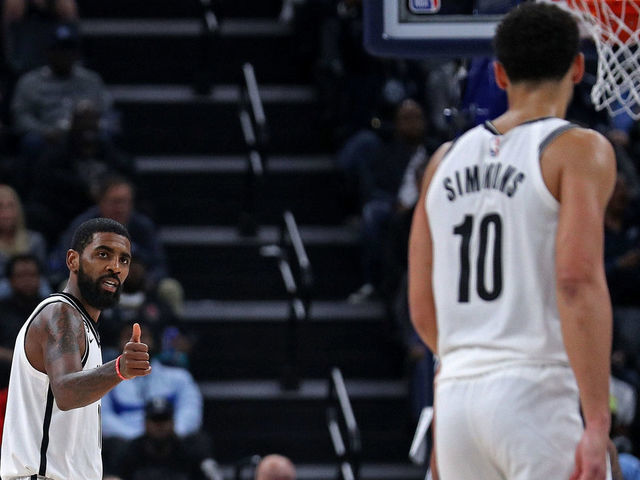 MEMPHIS, TENNESSEE - OCTOBER 24: Kyrie Irving #11 of the Brooklyn Nets gestures twoards Ben Simmons #10 during the game against the Memphis Grizzlies at FedExForum on October 24, 2022 in Memphis, Tennessee.
