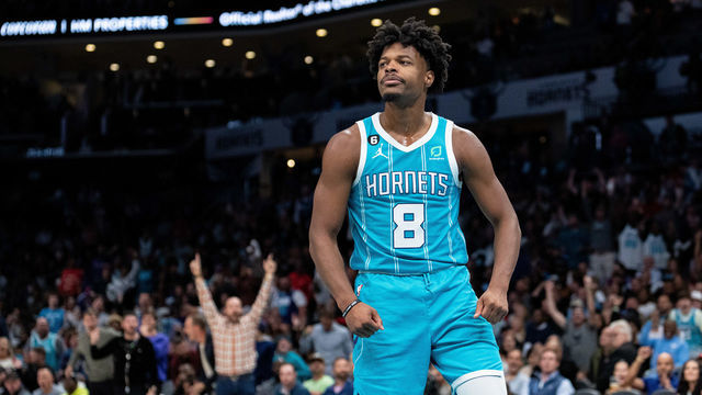 CHARLOTTE, NORTH CAROLINA - OCTOBER 21: Dennis Smith Jr. #8 of the Charlotte Hornets reacts after dunking the ball against the New Orleans Pelicans during their game at Spectrum Center on October 21, 2022 in Charlotte, North Carolina.
