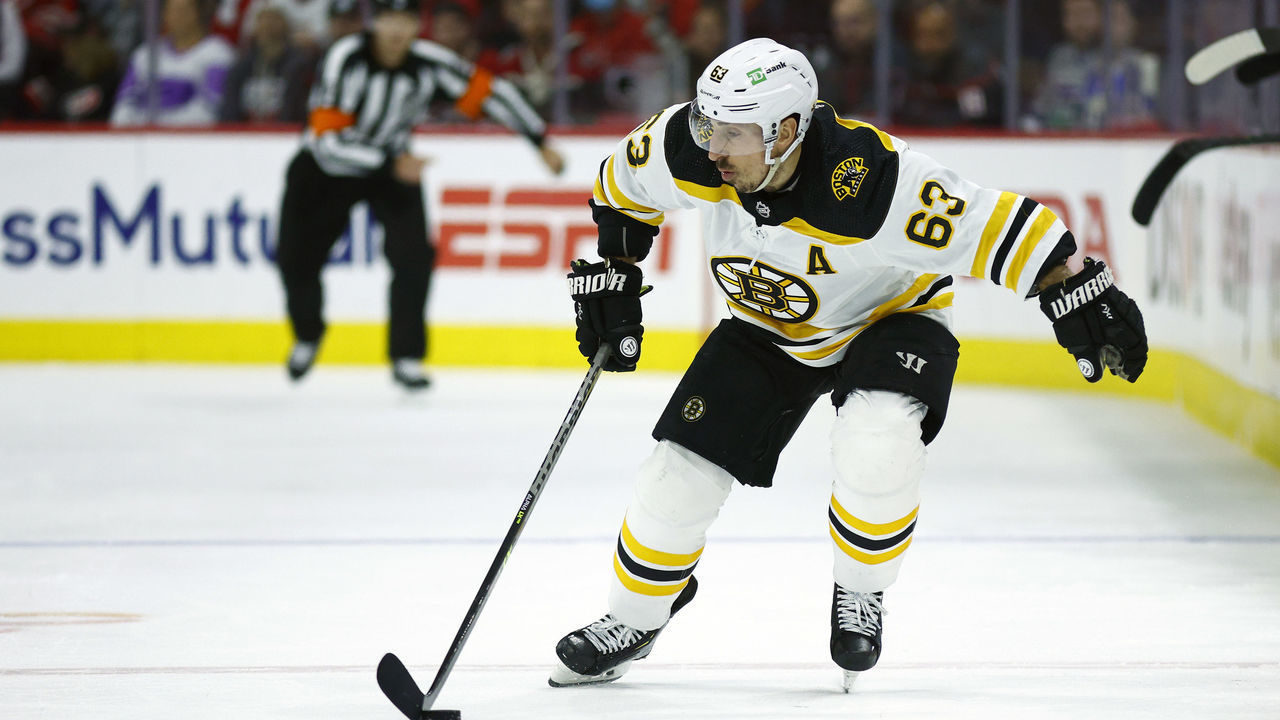 RALEIGH, NORTH CAROLINA - MAY 14: Brad Marchand #63 of the Boston Bruins skates with the puck during the third period in Game Seven of the First Round of the 2022 Stanley Cup Playoffs against the Carolina Hurricanes at PNC Arena on May 14, 2022 in Raleigh, North Carolina.