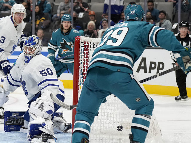 SAN JOSE, CALIFORNIA - OCTOBER 27: Logan Couture #39 of the San Jose Sharks scores his second goal of the night getting his shot past goalie Erik Kallgren #50 of the Toronto Maple Leafs during the second period of an NHL hockey game at SAP Center on October 27, 2022 in San Jose, California.
