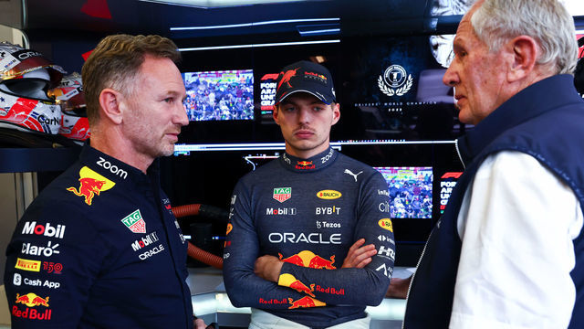 AUSTIN, TEXAS - OCTOBER 22: Max Verstappen of the Netherlands and Oracle Red Bull Racing (C) talks with Red Bull Racing Team Principal Christian Horner (L) and Red Bull Racing Team Consultant Dr Helmut Marko (R) in the garage during qualifying ahead of the F1 Grand Prix of USA at Circuit of The Americas on October 22, 2022 in Austin, Texas.