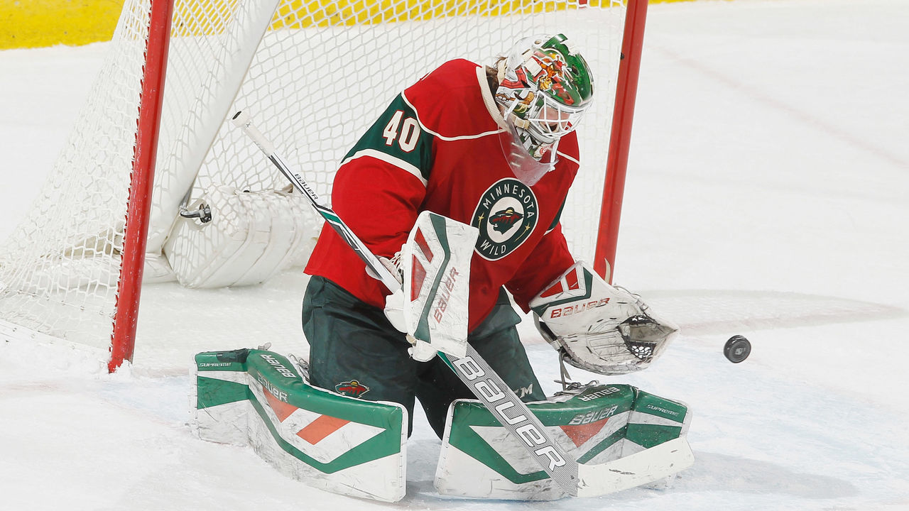 ST. PAUL, MN - MARCH 24: Devan Dubnyk #40 of the Minnesota Wild makes a save against the Calgary Flames during the game on March 24, 2016 at the Xcel Energy Center in St. Paul, Minnesota.