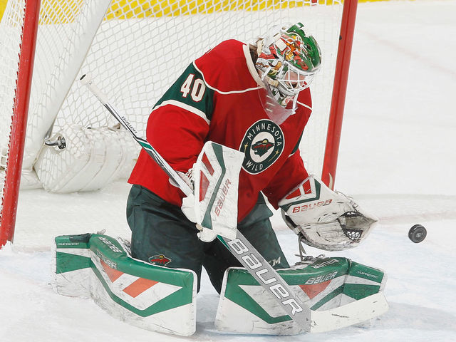 ST. PAUL, MN - MARCH 24: Devan Dubnyk #40 of the Minnesota Wild makes a save against the Calgary Flames during the game on March 24, 2016 at the Xcel Energy Center in St. Paul, Minnesota.