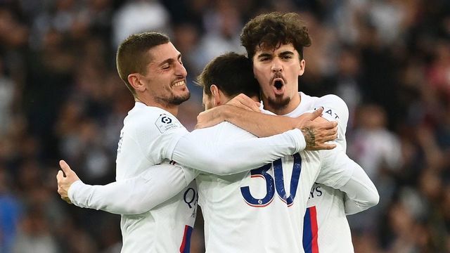 Paris Saint-Germain's Argentine forward Lionel Messi celebrates with Paris Saint-Germain's Italian midfielder Marco Verratti (L) and Paris Saint-Germain's Portuguese midfielder Vitinha after scoring his team's second goal during the French L1 football match between Paris Saint-Germain (PSG) and ES Troyes AC at The Parc des Princes Stadium in Paris on October 29, 2022.