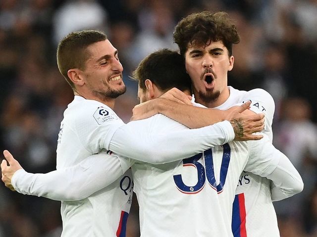 Paris Saint-Germain's Argentine forward Lionel Messi celebrates with Paris Saint-Germain's Italian midfielder Marco Verratti (L) and Paris Saint-Germain's Portuguese midfielder Vitinha after scoring his team's second goal during the French L1 football match between Paris Saint-Germain (PSG) and ES Troyes AC at The Parc des Princes Stadium in Paris on October 29, 2022.