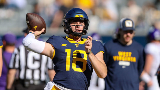MORGANTOWN, WV - OCTOBER 29: West Virginia Mountaineers quarterback JT Daniels (18) warms up prior to the college football game between the TCU Horned Frogs and the West Virginia Mountaineers on October 29, 2022, at Mountaineer Field at Milan Puskar Stadium in Morgantown, WV.