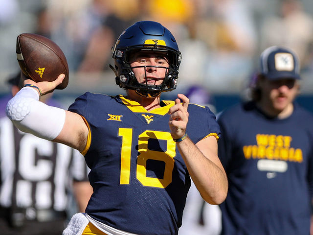 MORGANTOWN, WV - OCTOBER 29: West Virginia Mountaineers quarterback JT Daniels (18) warms up prior to the college football game between the TCU Horned Frogs and the West Virginia Mountaineers on October 29, 2022, at Mountaineer Field at Milan Puskar Stadium in Morgantown, WV.
