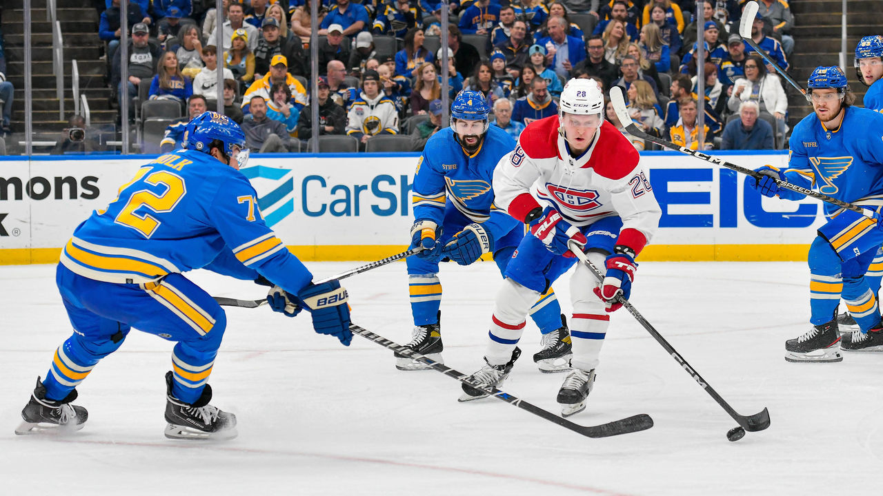 ST. LOUIS, MO - OCTOBER 29: Montreal Canadiens center Christian Dvorak (28) attempts to skate around the defense of St. Louis Blues defenseman Justin Faulk (72) during a game between the Montreal Canadians and the St. Louis Blues on October 29, 2022, at the Enterprise Center in St. Louis MO