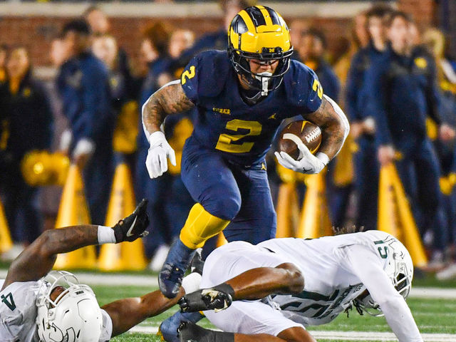 Corum runs wild No. 4 Michigan tops Michigan State to stay