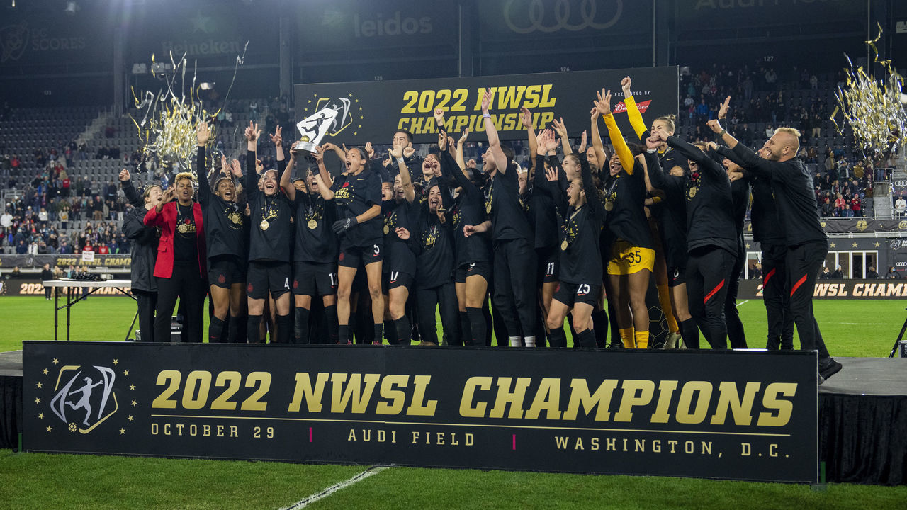 WASHINGTON, DC - OCTOBER 29: The Portland Thorns celebrates with the NWSL trophy after a NWSL Cup Final game between Kansas City Current and Portland Thorns FC at Audi Field on October 29, 2022 in Washington, DC.