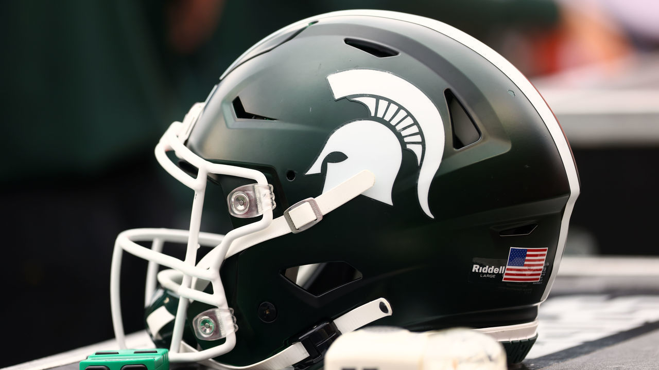 PISCATAWAY, NJ - OCTOBER 09 : A Michigan State Spartans helmet sits on the sidelines during a game against the Rutgers Scarlet Knights at SHI Stadium on October 9, 2021 in Piscataway, New Jersey. Michigan State defeated Rutgers 31-13.