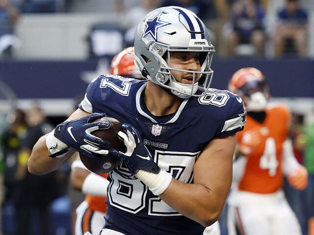 ARLINGTON, TEXAS - OCTOBER 30: Jake Ferguson #87 of the Dallas Cowboys catches a touchdown pass against the Chicago Bears during the second quarter at AT&T Stadium on October 30, 2022 in Arlington, Texas.