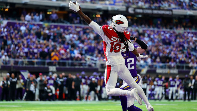 MINNEAPOLIS, MINNESOTA - OCTOBER 30: DeAndre Hopkins #10 of the Arizona Cardinals catches the ball for a touchdown as Harrison Smith #22 of the Minnesota Vikings defends during the second quarter at U.S. Bank Stadium on October 30, 2022 in Minneapolis, Minnesota.