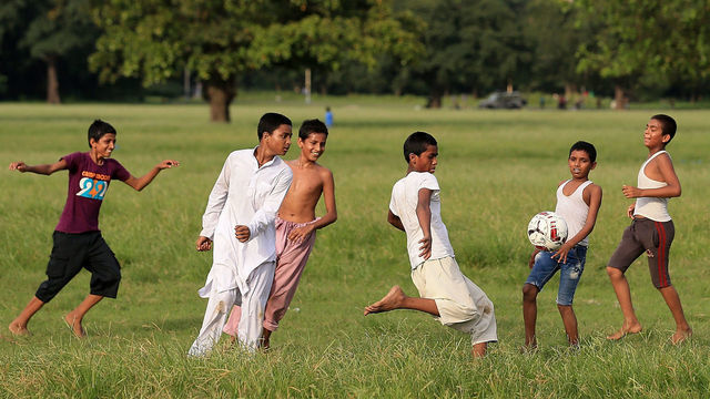 KOLKATA, INDIA - OCTOBER 05: General view of local children playing football ahead of the FIFA U-17 World Cup India 2017 tournament on October 5, 2017 in Kolkata, India.