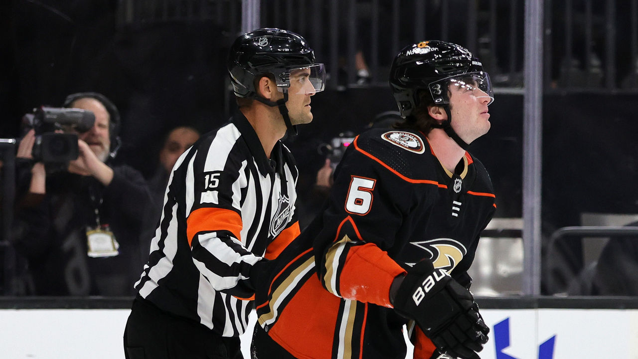 LAS VEGAS, NEVADA - OCTOBER 28: Referee Jean Hebert helps Jamie Drysdale #6 of the Anaheim Ducks off the ice after he suffered an upper body injury in the second period of a game against the Vegas Golden Knights at T-Mobile Arena on October 28, 2022 in Las Vegas, Nevada. The Golden Knights defeated the Ducks 4-0.