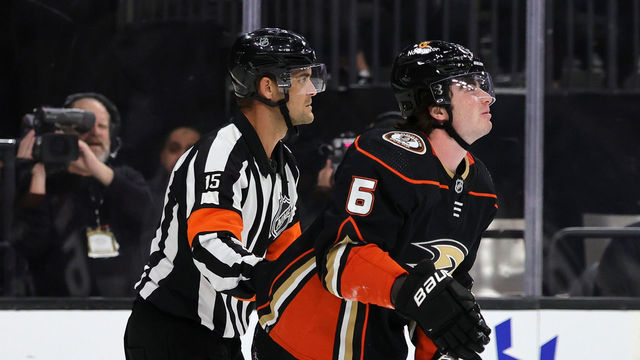 LAS VEGAS, NEVADA - OCTOBER 28: Referee Jean Hebert helps Jamie Drysdale #6 of the Anaheim Ducks off the ice after he suffered an upper body injury in the second period of a game against the Vegas Golden Knights at T-Mobile Arena on October 28, 2022 in Las Vegas, Nevada. The Golden Knights defeated the Ducks 4-0.