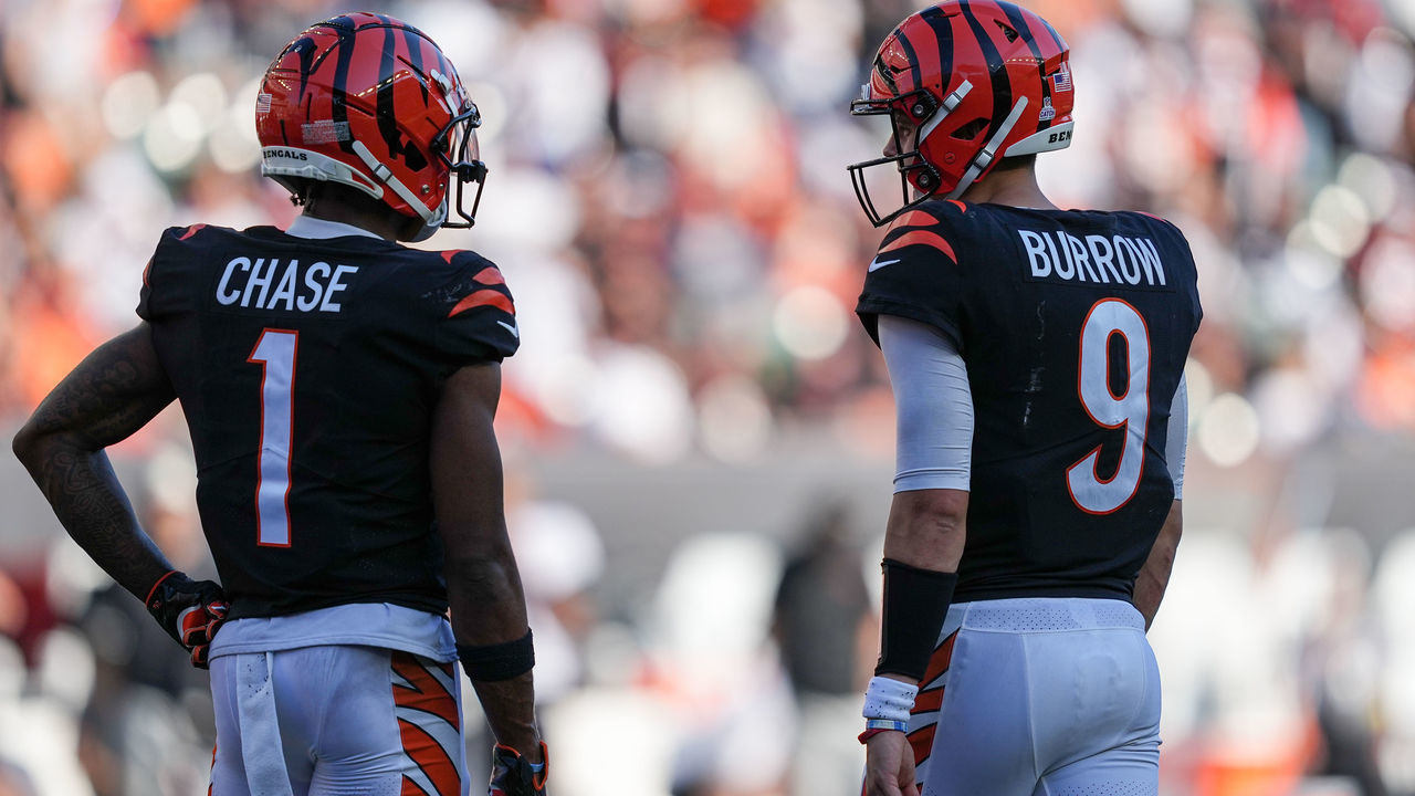 CINCINNATI, OHIO - OCTOBER 23: Ja'Marr Chase #1 and Joe Burrow #9 of the Cincinnati Bengals meet in the fourth quarter against the Atlanta Falcons at Paycor Stadium on October 23, 2022 in Cincinnati, Ohio.