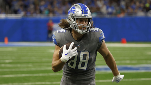 DETROIT, MICHIGAN - OCTOBER 30: T.J. Hockenson #88 of the Detroit Lions runs for a first down during the second quarter against the Miami Dolphins at Ford Field on October 30, 2022 in Detroit, Michigan.