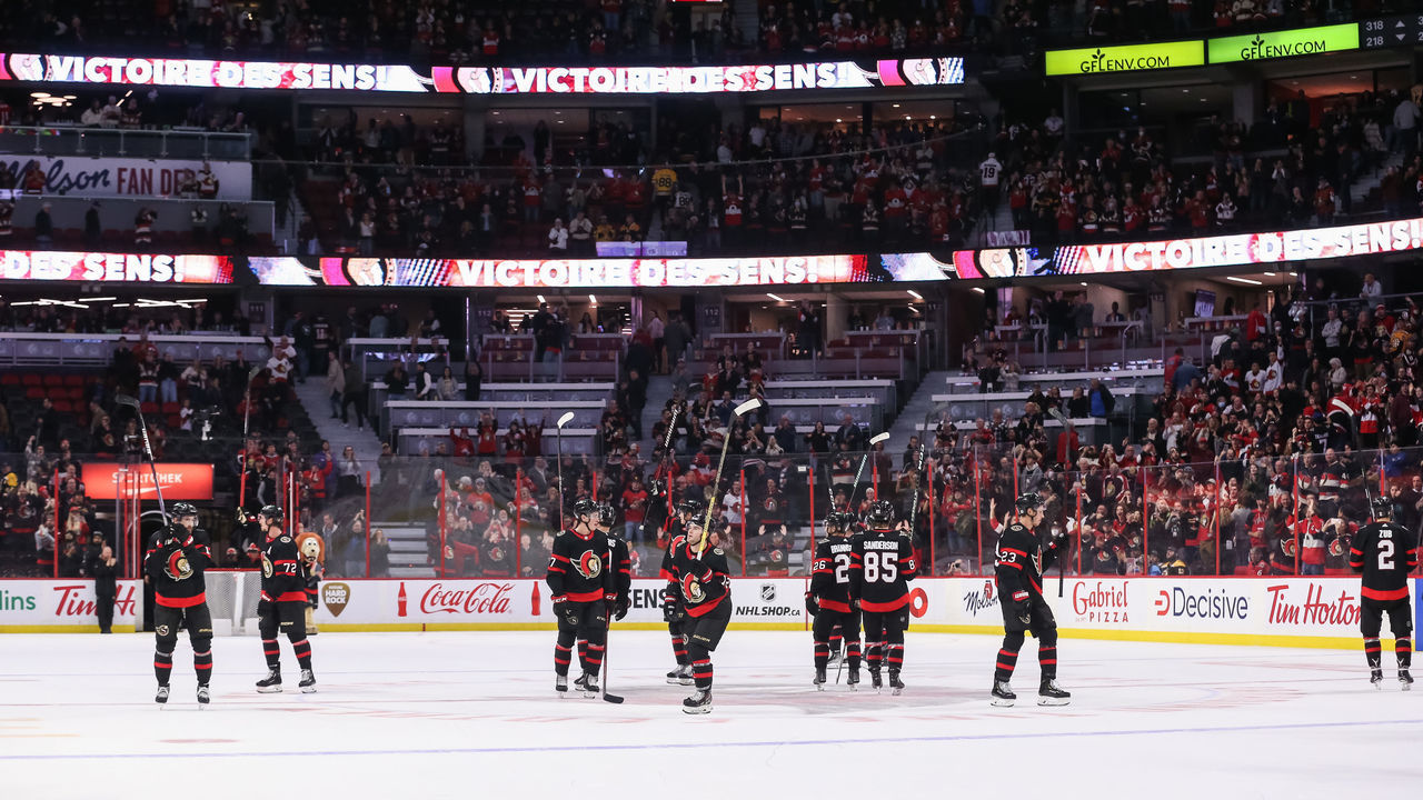 OTTAWA, CANADA - OCTOBER 18: The Ottawa Senators salute the crowd following a 7-5 win against the Boston Bruins at Canadian Tire Centre on October 18, 2022 in Ottawa, Ontario, Canada.