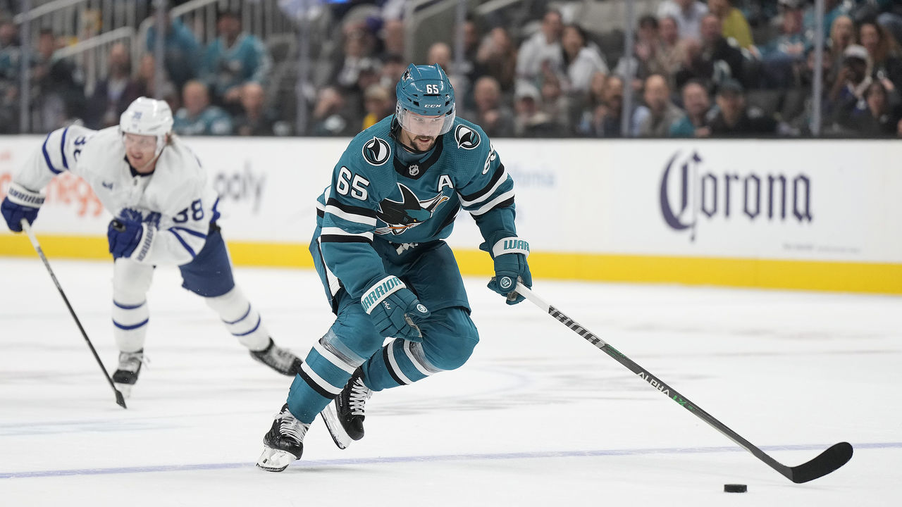 SAN JOSE, CALIFORNIA - OCTOBER 27: Erik Karlsson #65 of the San Jose Sharks skates up ice on a break away against the Toronto Maple Leafs during the overtime period of an NHL hockey game at SAP Center on October 27, 2022 in San Jose, California.