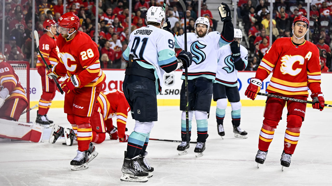 CALGARY, AB - NOVEMBER 01: Seattle Kraken Right Wing Daniel Sprong (91) celebrates a goal with Seattle Kraken Right Wing Oliver Bjorkstrand (22) during the third period of an NHL game between the Calgary Flames and the Seattle Kraken on November 1, 2022, at the Scotiabank Saddledome in Calgary, AB.