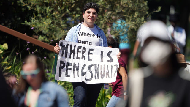 A protester holding a sign and wearing a t-shirt reading "where is Peng Shuai" on day twelve of the 2022 Wimbledon Championships at the All England Lawn Tennis and Croquet Club, Wimbledon. Picture date: Friday July 8, 2022.