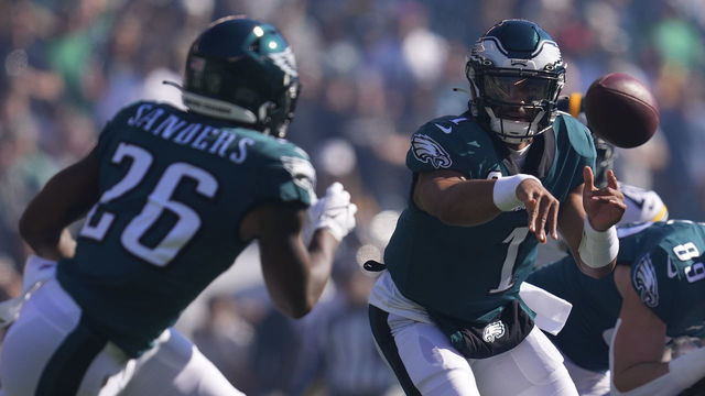 PHILADELPHIA, PA - OCTOBER 30: Jalen Hurts #1 of the Philadelphia Eagles pitches the ball to Miles Sanders #26 against the Pittsburgh Steelers at Lincoln Financial Field on October 30, 2022 in Philadelphia, Pennsylvania.