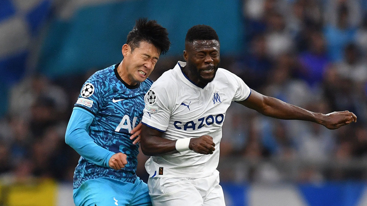 MARSEILLE, FRANCE - NOVEMBER 01: Son Heung-Min of Tottenham Hotspur jumps for the ball with Chancel Mbemba of Marseille during the UEFA Champions League group D match between Olympique Marseille and Tottenham Hotspur at Orange Velodrome on November 01, 2022 in Marseille, France.