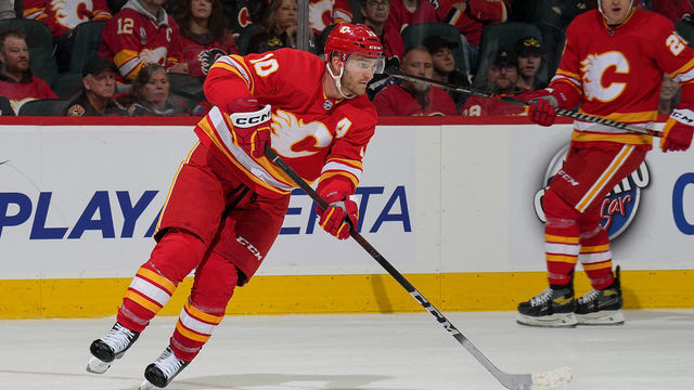 CALGARY, AB - NOVEMBER 1: Jonathan Huberdeau #10 of the Calgary Flames plays the puck against the Seattle Kraken at Scotiabank Saddledome on November 1, 2022 in Calgary, Alberta, Canada.
