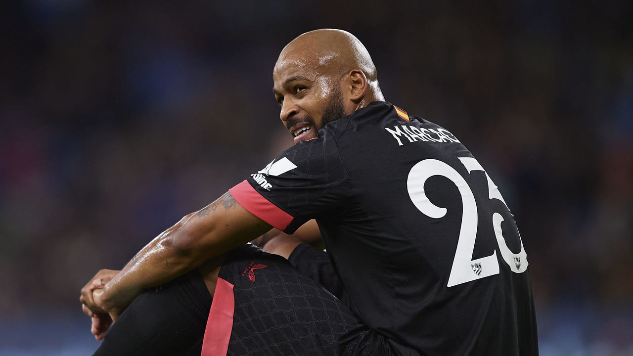 MANCHESTER, ENGLAND - NOVEMBER 02: Marcao of Sevilla FC lies injured on the pitch during the UEFA Champions League group G match between Manchester City and Sevilla FC at Etihad Stadium on November 02, 2022 in Manchester, England.