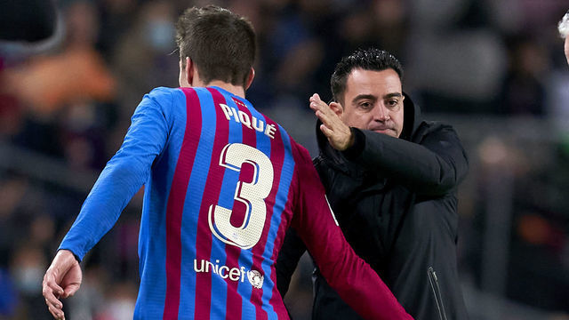 BARCELONA, SPAIN - MARCH 13: Gerard Pique of FC Barcelona is saluted by his head coach Xavi Hernandez during the LaLiga Santander match between FC Barcelona and CA Osasuna at Camp Nou on March 13, 2022 in Barcelona, Spain.