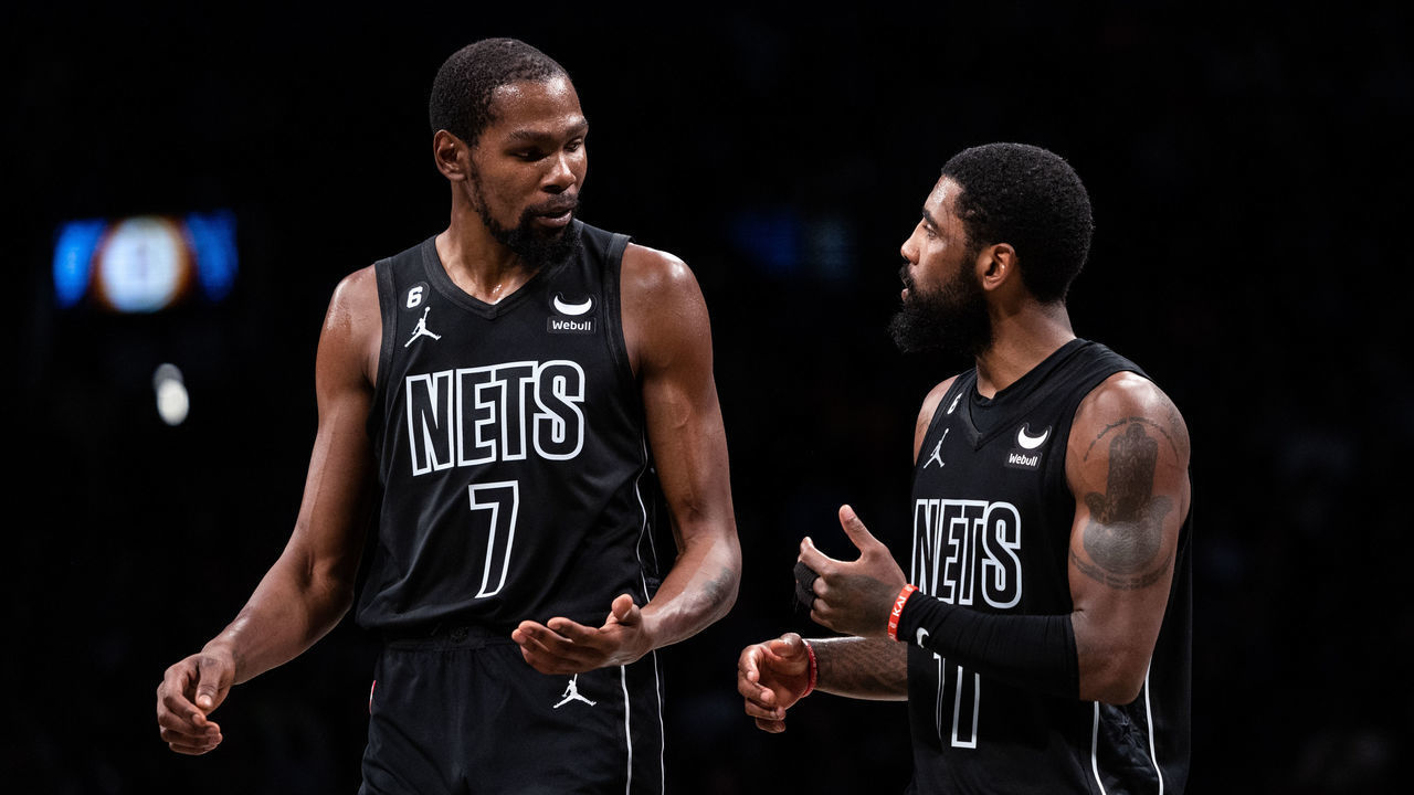 NEW YORK, NEW YORK - OCTOBER 31: Kevin Durant #7 speaks with Kyrie Irving #11 of the Brooklyn Nets during a break in the action during the fourth quarter of the game against the Indiana Pacers at Barclays Center on October 31, 2022 in New York City.