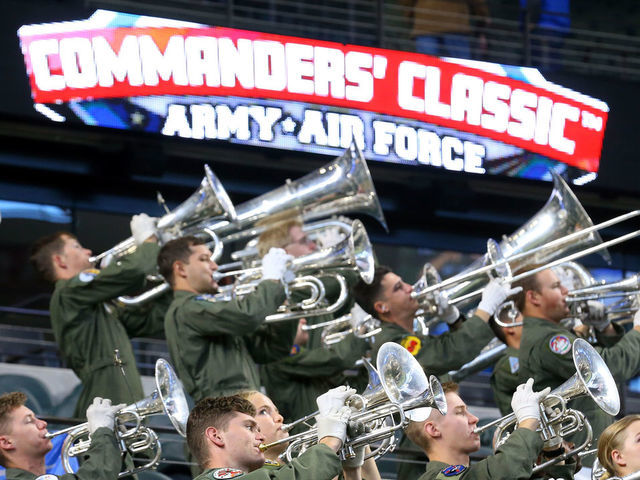 ARLINGTON, TEXAS - NOVEMBER 06: The Air Force band warms up before the start of the Commanders Classic at Globe Life Field on November 06, 2021 in Arlington, Texas.