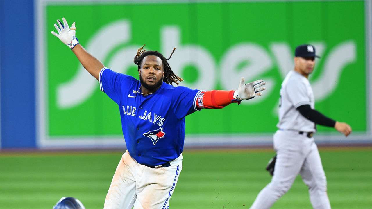 TORONTO, ON - SEPTEMBER 26: Toronto Blue Jays First base Vladimir Guerrero Jr. (27) celebrates after hitting a game scoring single during the tenth inning of the MLB baseball regular season game between the New York Yankees and the Toronto Blue Jays on September 26, 2022, at Rogers Centre in Toronto, ON, Canada.