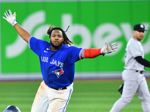 TORONTO, ON - SEPTEMBER 26: Toronto Blue Jays First base Vladimir Guerrero Jr. (27) celebrates after hitting a game scoring single during the tenth inning of the MLB baseball regular season game between the New York Yankees and the Toronto Blue Jays on September 26, 2022, at Rogers Centre in Toronto, ON, Canada.
