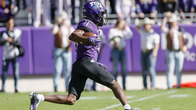 FORT WORTH, TX - NOVEMBER 05: TCU Horned Frogs wide receiver Derius Davis (11) returns a punt during the game between the TCU Horned Frogs and the Texas Tech Red Raiders on November 5, 2022 at Amon G. Carter Stadium in Fort Worth, Texas.
