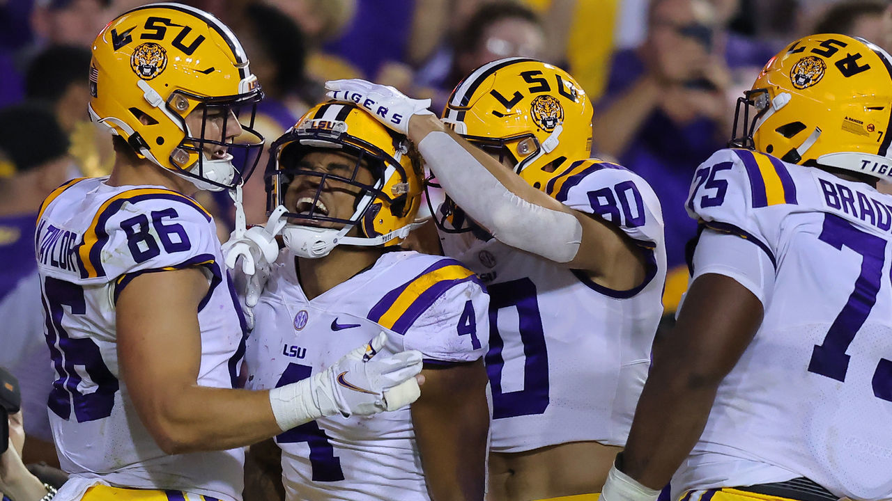 BATON ROUGE, LOUISIANA - NOVEMBER 05: John Emery Jr. #4 of the LSU Tigers celebrates a touchdown during the first half against the Alabama Crimson Tide at Tiger Stadium on November 05, 2022 in Baton Rouge, Louisiana.