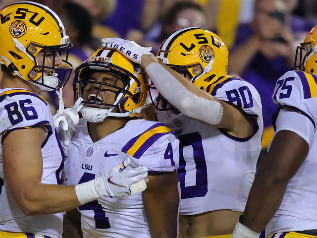 BATON ROUGE, LOUISIANA - NOVEMBER 05: John Emery Jr. #4 of the LSU Tigers celebrates a touchdown during the first half against the Alabama Crimson Tide at Tiger Stadium on November 05, 2022 in Baton Rouge, Louisiana.
